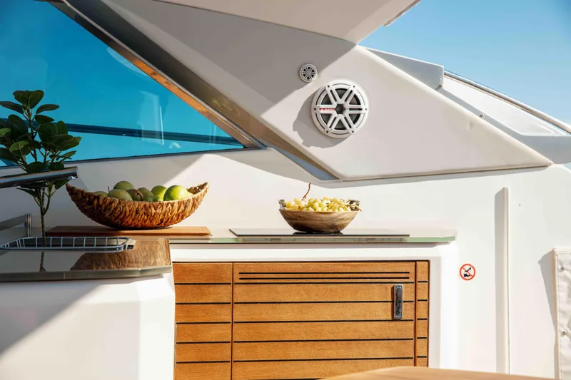  Yacht Photos Pics Luxurious 2008 Sessa Marine C46 yacht interior with fruit bowls and sleek wooden cabinetry.