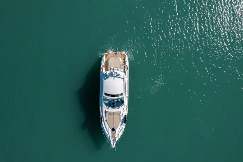  Yacht Photos Pics Aerial view of 2008 Sessa Marine C46 yacht on turquoise water.