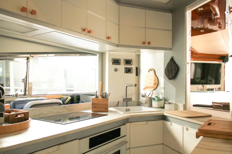 My Way Victoria Yacht Photos Pics Luxurious kitchen interior of 2007 Dominator 860 Fly yacht, featuring modern appliances and sleek design.