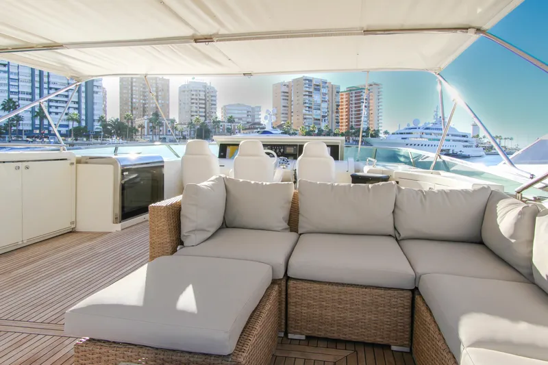 My Way Victoria Yacht Photos Pics Luxurious 2007 Dominator 860 Fly yacht interior with cityscape view, featuring elegant seating and modern amenities.