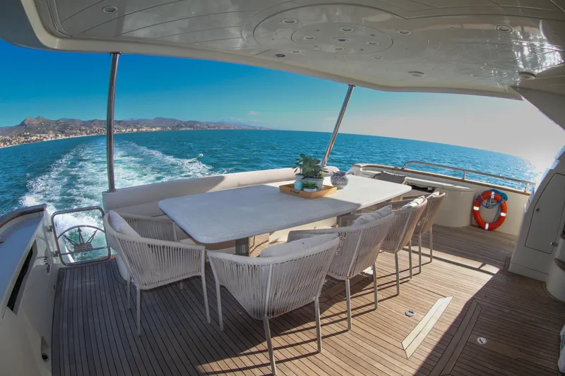 My Way Victoria Yacht Photos Pics Luxury yacht Dominator 860 Fly 2007, featuring elegant outdoor dining area with ocean view.