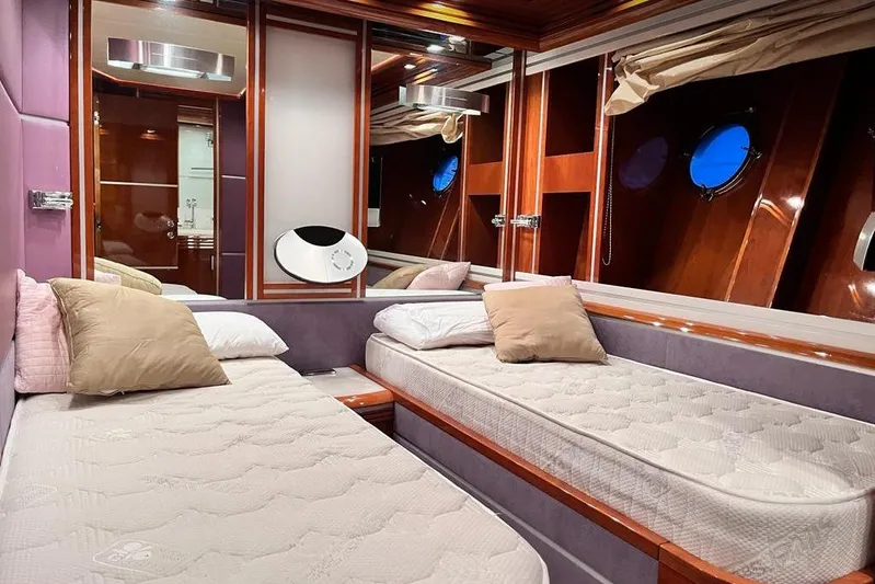 My Way Victoria Yacht Photos Pics Luxurious 2007 Dominator 860 Fly yacht cabin with twin beds and elegant wood finish.