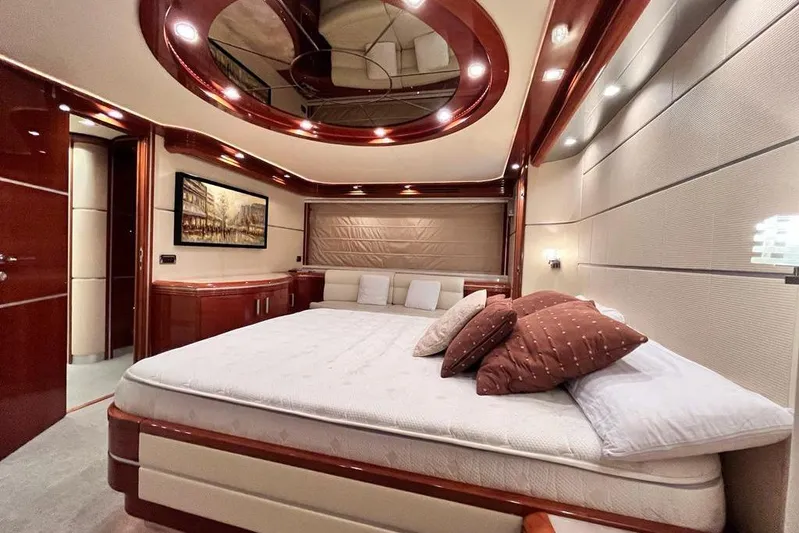 My Way Victoria Yacht Photos Pics Luxurious bedroom interior of 2007 Dominator 860 Fly yacht with elegant wood finishes.