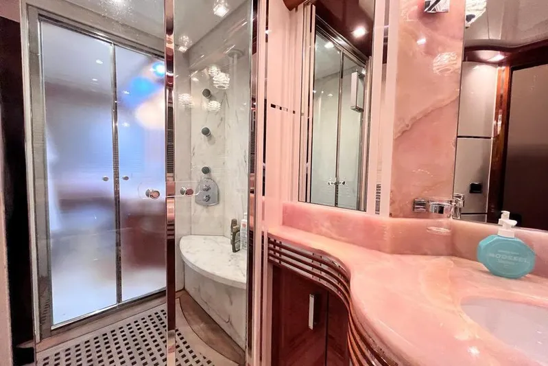 My Way Victoria Yacht Photos Pics Luxurious bathroom in 2007 Dominator 860 Fly yacht with marble shower and pink countertop.