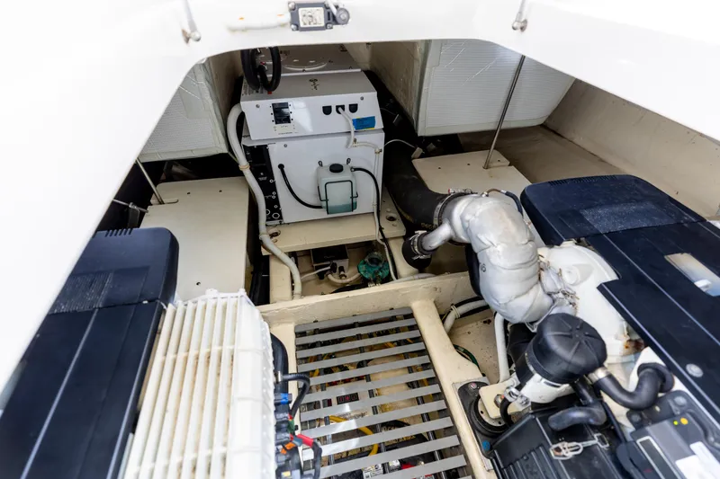 Silver Lining Yacht Photos Pics Engine room of 2015 Tiara Yachts 44 Coupe, showcasing mechanical components and systems.