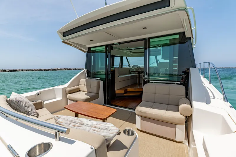 Silver Lining Yacht Photos Pics 2015 Tiara Yachts 44 Coupe with spacious outdoor seating and ocean view.