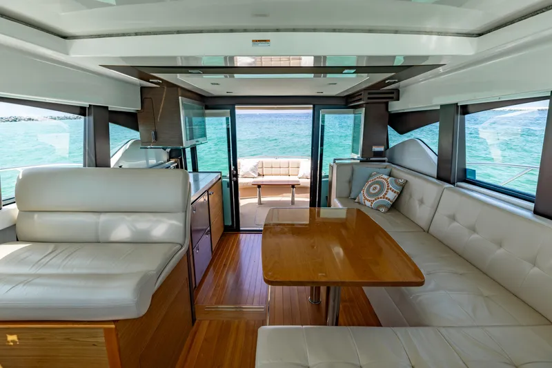 Silver Lining Yacht Photos Pics Interior of 2015 Tiara Yachts 44 Coupe with elegant seating and ocean view.