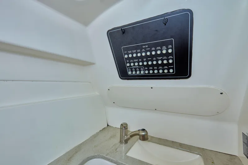 Hitm Yacht Photos Pics Interior of 2016 Boston Whaler 320 Vantage, featuring control panel and sink.