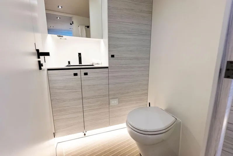 Shaloha Yacht Photos Pics Modern bathroom interior on the 2022 Vanquish Yachts VQ58, featuring sleek design and high-end fixtures.