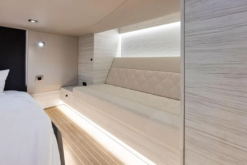 Shaloha Yacht Photos Pics Luxurious interior of 2022 Vanquish Yachts VQ58 with modern seating and ambient lighting.