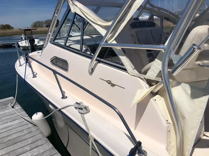  Yacht Photos Pics 2009 Grady-White CHESAPEAKE boat docked, featuring sleek design and sturdy railings.