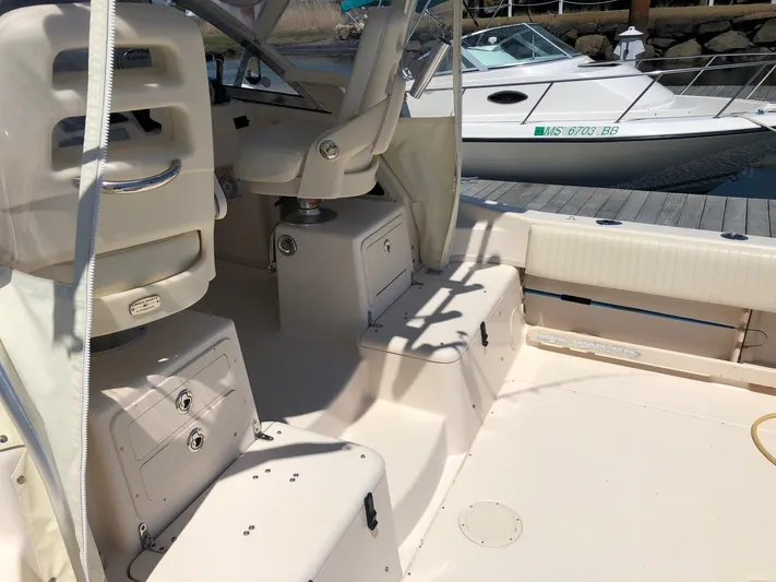  Yacht Photos Pics 2009 Grady-White CHESAPEAKE boat interior, featuring seating and storage, docked at marina.