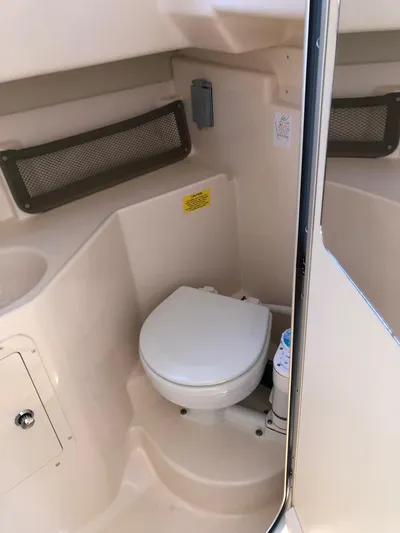  Yacht Photos Pics 2009 Grady-White CHESAPEAKE boat interior with compact marine toilet.