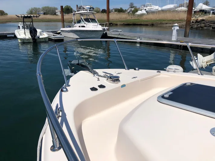  Yacht Photos Pics 2009 Grady-White CHESAPEAKE boat docked in a marina, calm water, clear sky.