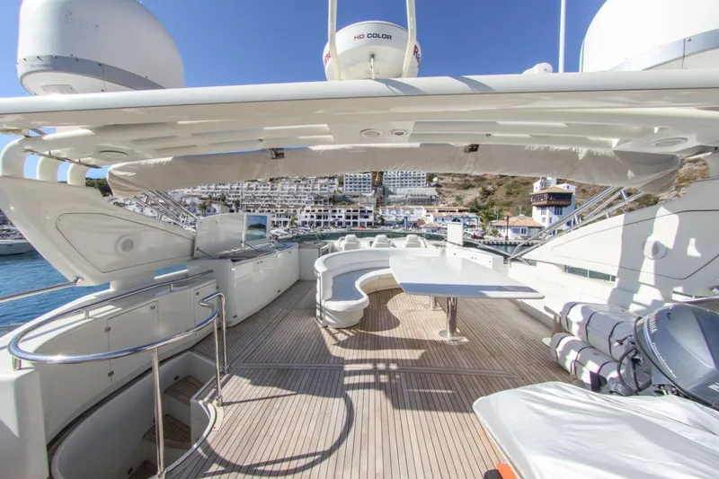 My Way Victoria Yacht Photos Pics Luxurious 2007 Dominator 860 Fly yacht deck with seating and table, overlooking marina.