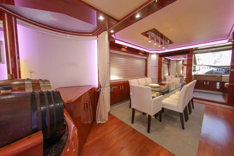My Way Victoria Yacht Photos Pics Luxurious interior of 2007 Dominator 860 Fly yacht with elegant dining area and ambient lighting.