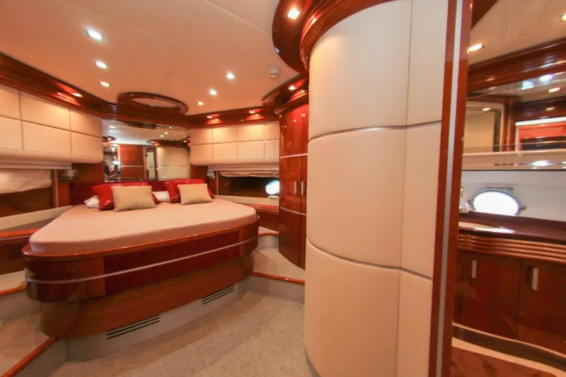 My Way Victoria Yacht Photos Pics Luxurious interior of 2007 Dominator 860 Fly yacht with elegant wood finishes and plush bedding.
