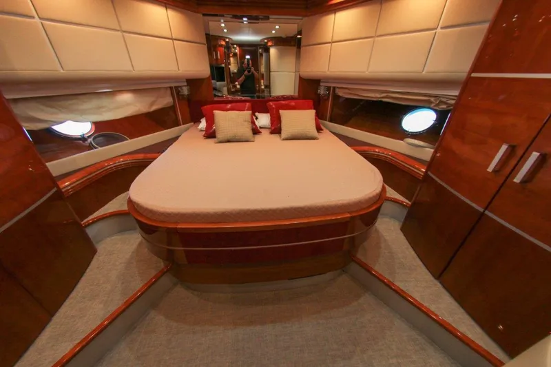 My Way Victoria Yacht Photos Pics Luxurious bedroom interior of 2007 Dominator 860 Fly yacht with elegant wood finishes.