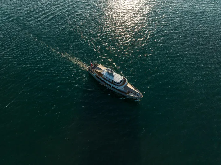 La Fenice Yacht Photos Pics Aerial view of 1962 Richard Ironworks custom boat cruising on open water.