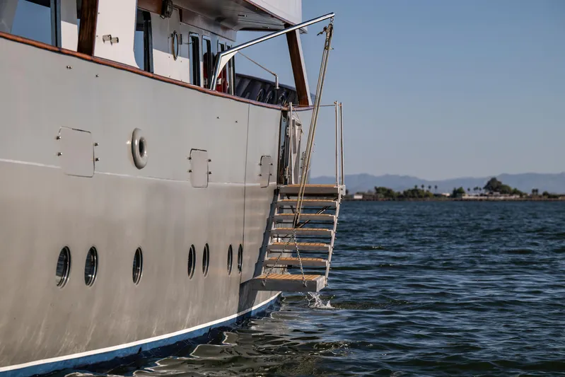 La Fenice Yacht Photos Pics Side view of 1962 Custom Richard Ironworks yacht with water access stairs.