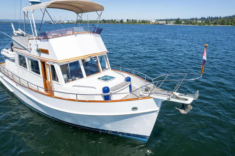 Celebration Yacht Photos Pics 1988 Grand Banks 42 Classic yacht cruising on open water.