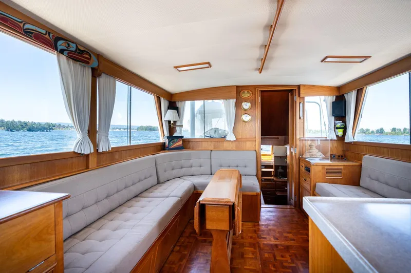 Celebration Yacht Photos Pics Interior of 1988 Grand Banks 42 Classic yacht with elegant wood finish and spacious seating.