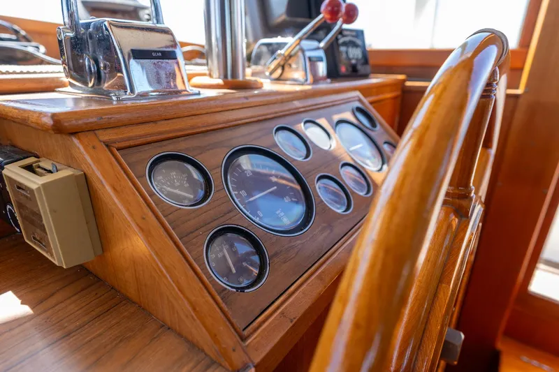 Celebration Yacht Photos Pics Helm of 1988 Grand Banks 42 Classic yacht with wooden dashboard and gauges.