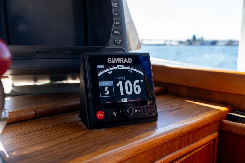 Celebration Yacht Photos Pics Simrad navigation display on 1988 Grand Banks 42 Classic yacht, showing heading 106 degrees.