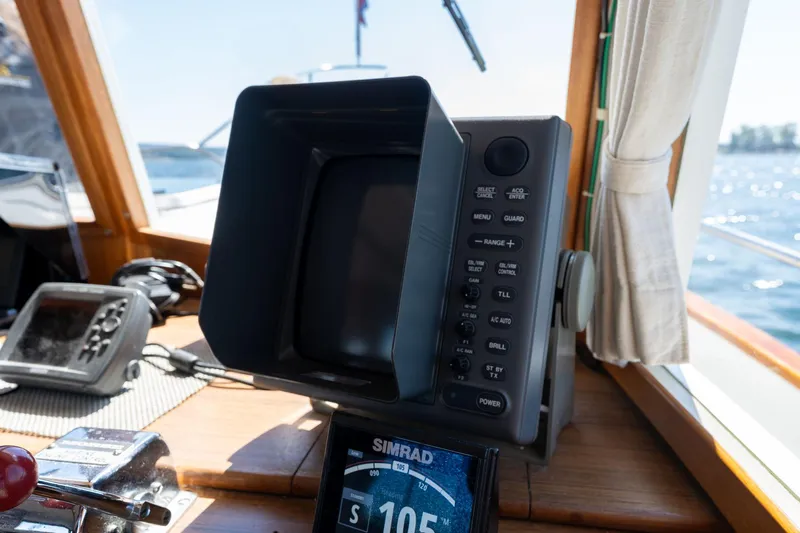 Celebration Yacht Photos Pics Navigation equipment on 1988 Grand Banks 42 Classic yacht, featuring Simrad display and control panel.