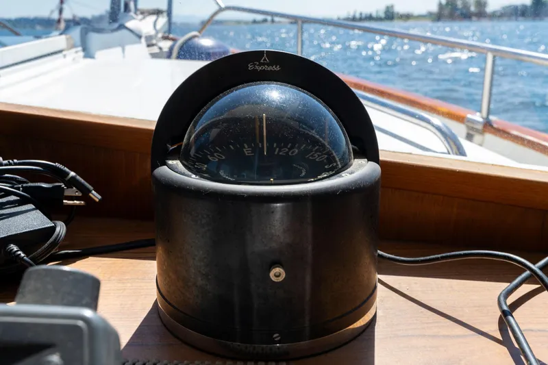 Celebration Yacht Photos Pics Compass on 1988 Grand Banks 42 Classic boat, with ocean view in background.