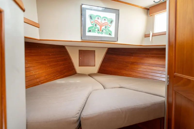 Celebration Yacht Photos Pics Cozy cabin interior of 1988 Grand Banks 42 Classic yacht with wooden paneling.