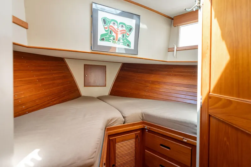 Celebration Yacht Photos Pics Cozy cabin interior of 1988 Grand Banks 42 Classic yacht with wooden paneling.