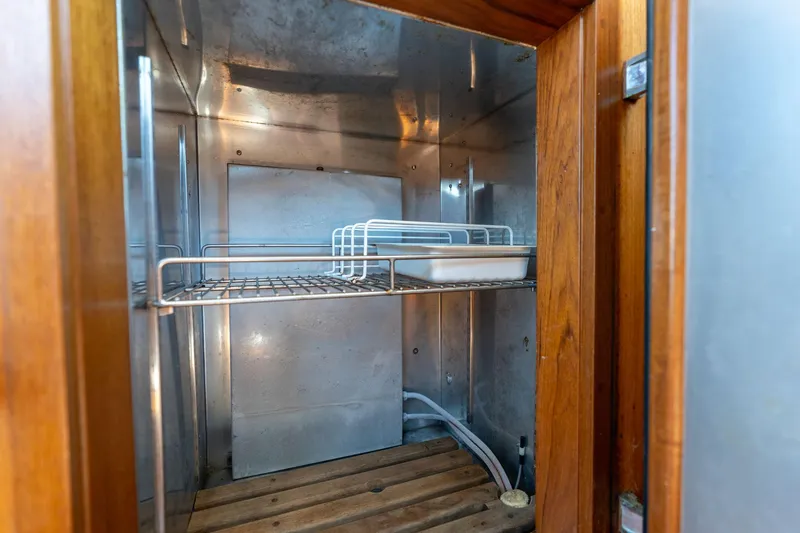 Celebration Yacht Photos Pics Empty metal storage compartment inside a 1988 Grand Banks 42 Classic boat.