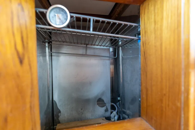 Celebration Yacht Photos Pics Interior of a 1988 Grand Banks 42 Classic boat, featuring a metal storage compartment.