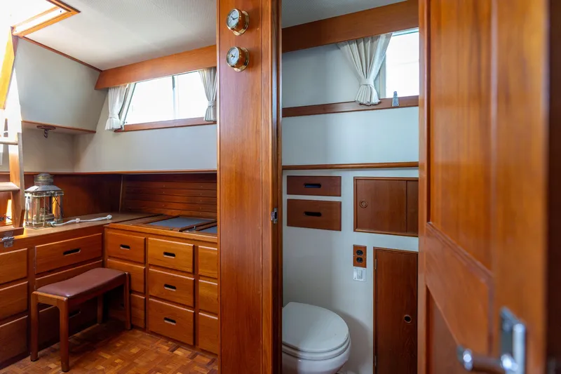 Celebration Yacht Photos Pics 1988 Grand Banks 42 Classic interior with wooden cabinetry and nautical decor.