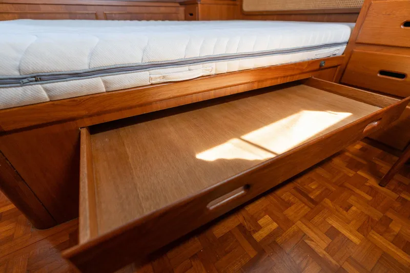 Celebration Yacht Photos Pics Under-bed storage drawer in 1988 Grand Banks 42 Classic yacht cabin.