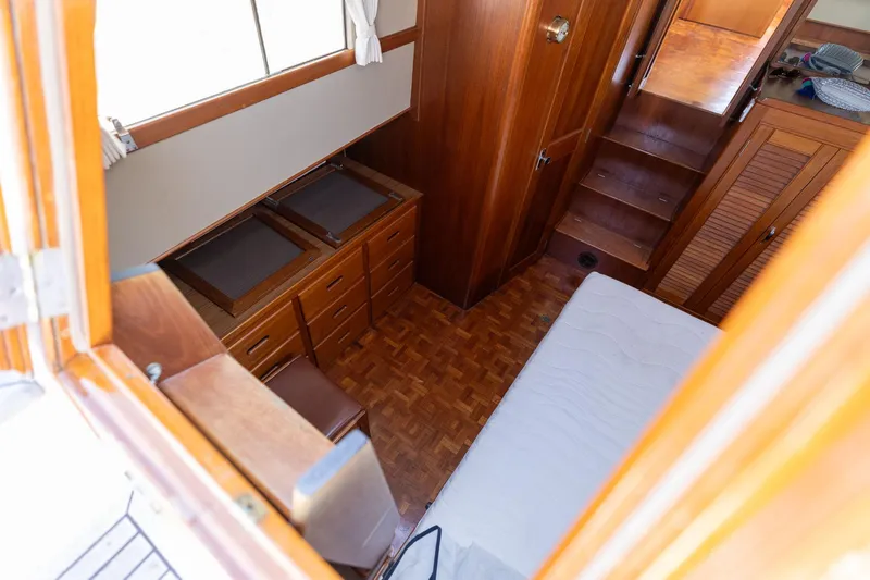 Celebration Yacht Photos Pics Interior of 1988 Grand Banks 42 Classic yacht with wooden cabinetry and stairs.