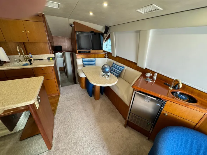  Yacht Photos Pics Luxurious interior of a 2001 Ocean Yachts 48, featuring a cozy dining area and modern amenities.