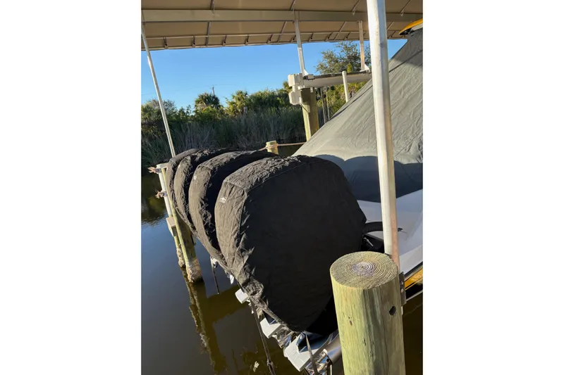  Yacht Photos Pics 2017 Nor-Tech 390 Sport Center Console with covered engines at dock.