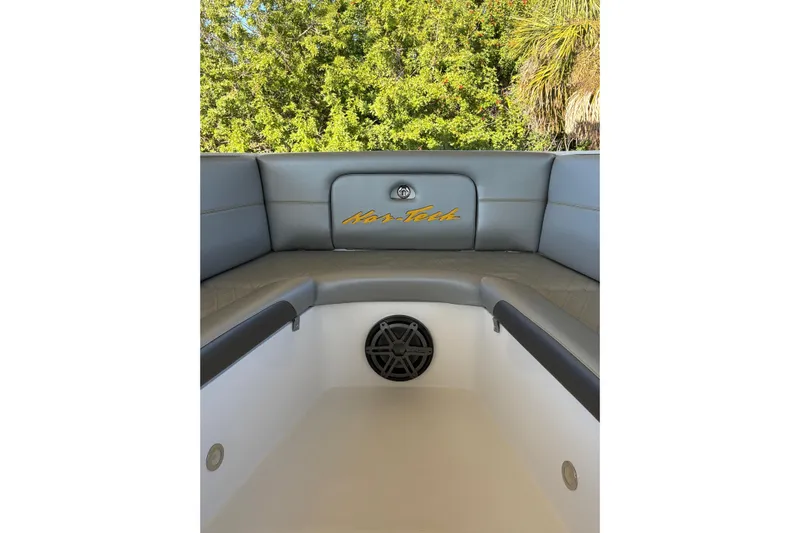  Yacht Photos Pics 2017 Nor-Tech 390 Sport Center Console boat interior with cushioned seating and speaker.