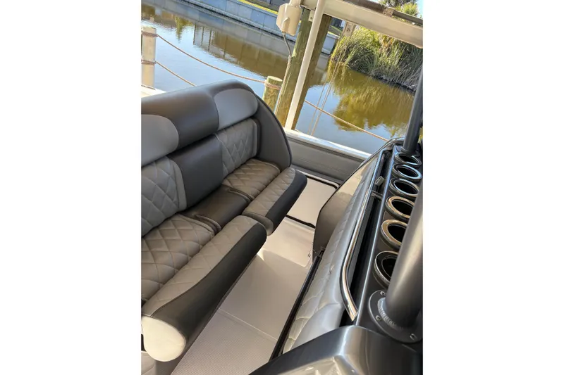 Yacht Photos Pics 2017 Nor-Tech 390 Sport Center Console interior with luxurious seating and cup holders.