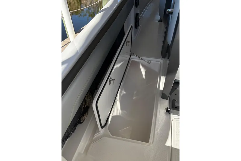  Yacht Photos Pics 2017 Nor-Tech 390 Sport Center Console storage compartment open on deck.