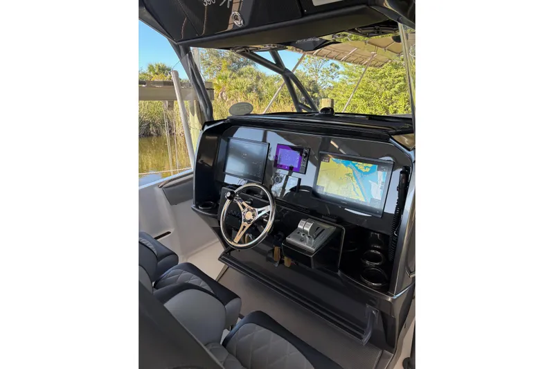  Yacht Photos Pics 2017 Nor-Tech 390 Sport Center Console helm with advanced navigation displays.