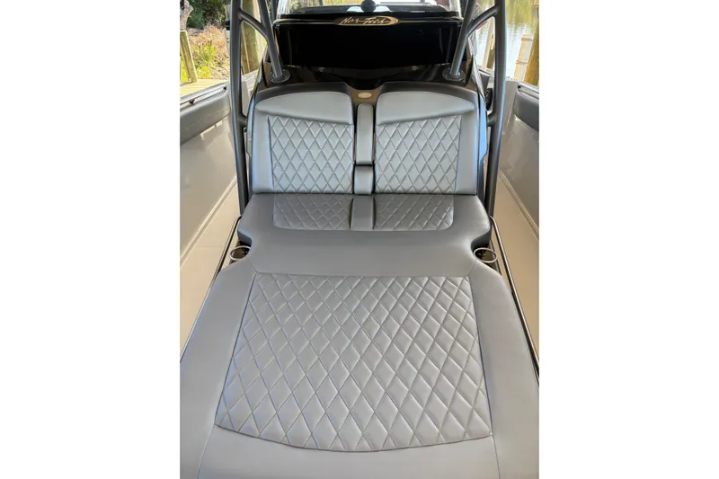  Yacht Photos Pics 2017 Nor-Tech 390 Sport Center Console interior with diamond-stitched gray seating.