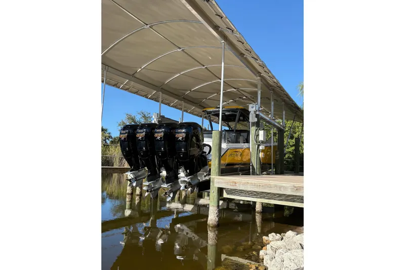  Yacht Photos Pics 2017 Nor-Tech 390 Sport Center Console with multiple outboard engines under a canopy.