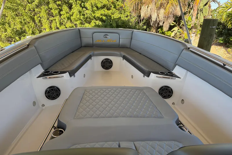  Yacht Photos Pics 2017 Nor-Tech 390 Sport Center Console boat interior with gray seating and speakers.