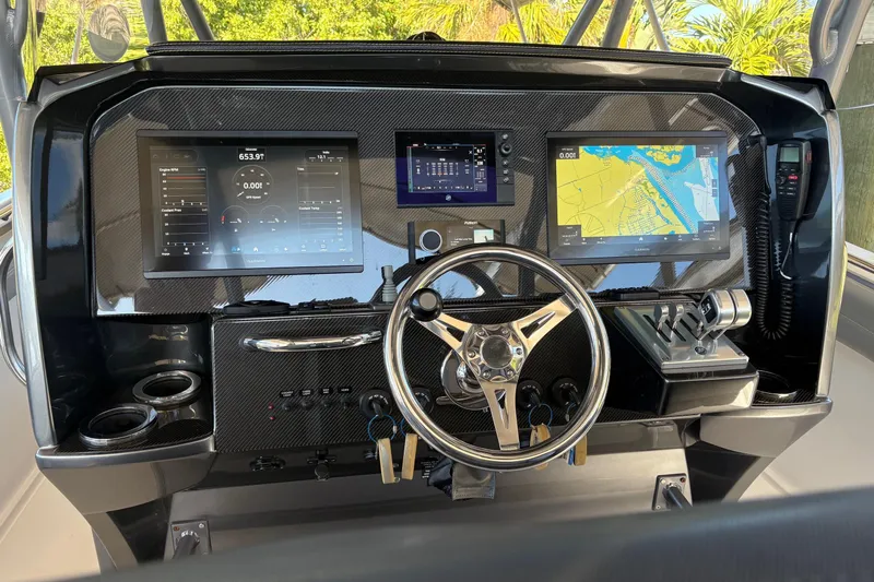  Yacht Photos Pics 2017 Nor-Tech 390 Sport Center Console dashboard with navigation and control systems.