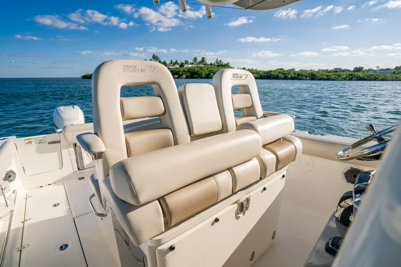 Mama J Yacht Photos Pics 2021 Boston Whaler 330 Outrage boat interior with luxurious seating, ocean view.