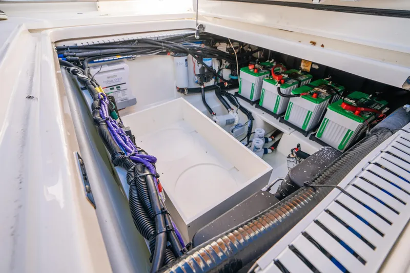 Mama J Yacht Photos Pics 2021 Boston Whaler 330 Outrage engine compartment with batteries and wiring.