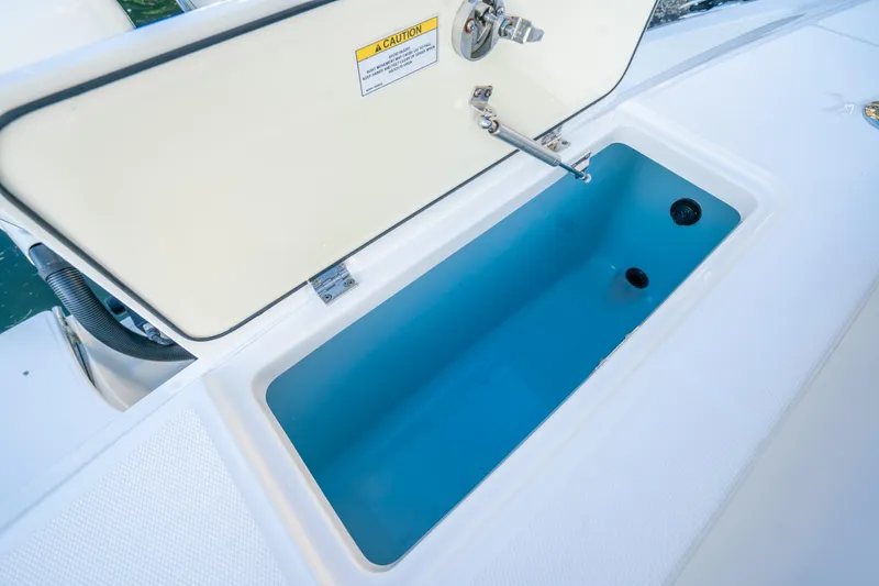 Mama J Yacht Photos Pics Open storage compartment on 2021 Boston Whaler 330 Outrage boat.